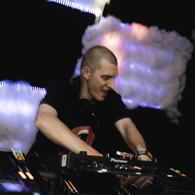 Brook B behind the decks under the LED clouds at his Season 4 set